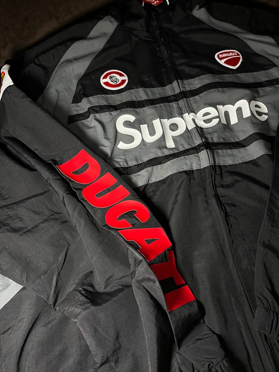 Supreme x Ducati Track Jacket シュプリーム Supreme Ducati Track Jacket Light Grey Men's - SS24 - GB